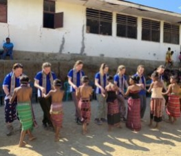Immersion students from Assumption College Kilmore dancing with children in Timor-Leste